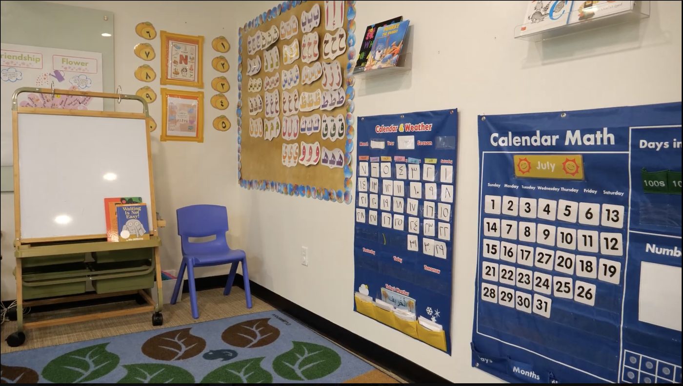 A BAMREC Preschool classroom, with the Arabic alphabet and the calendar on the wall