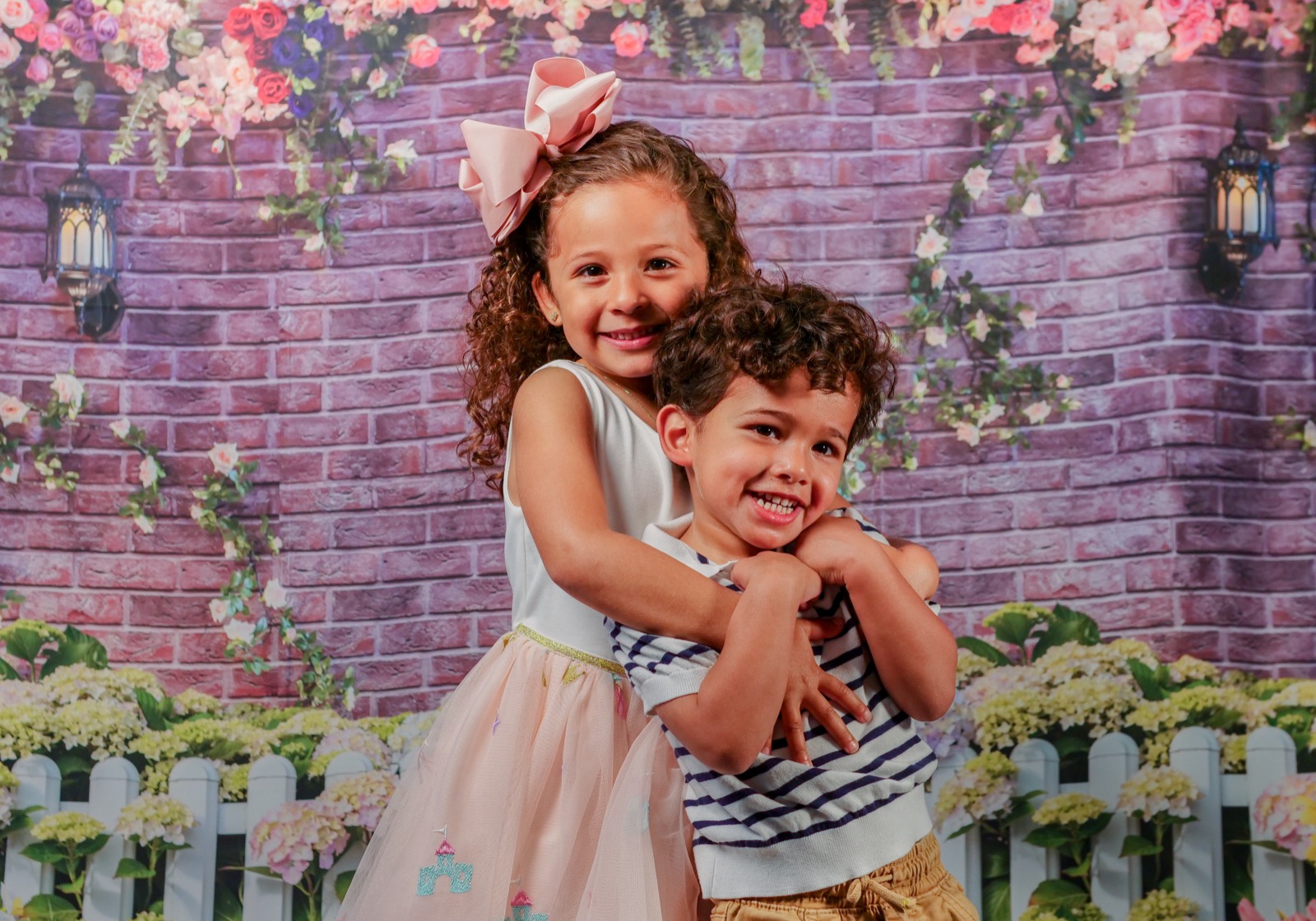 Two children hugging on portrait day